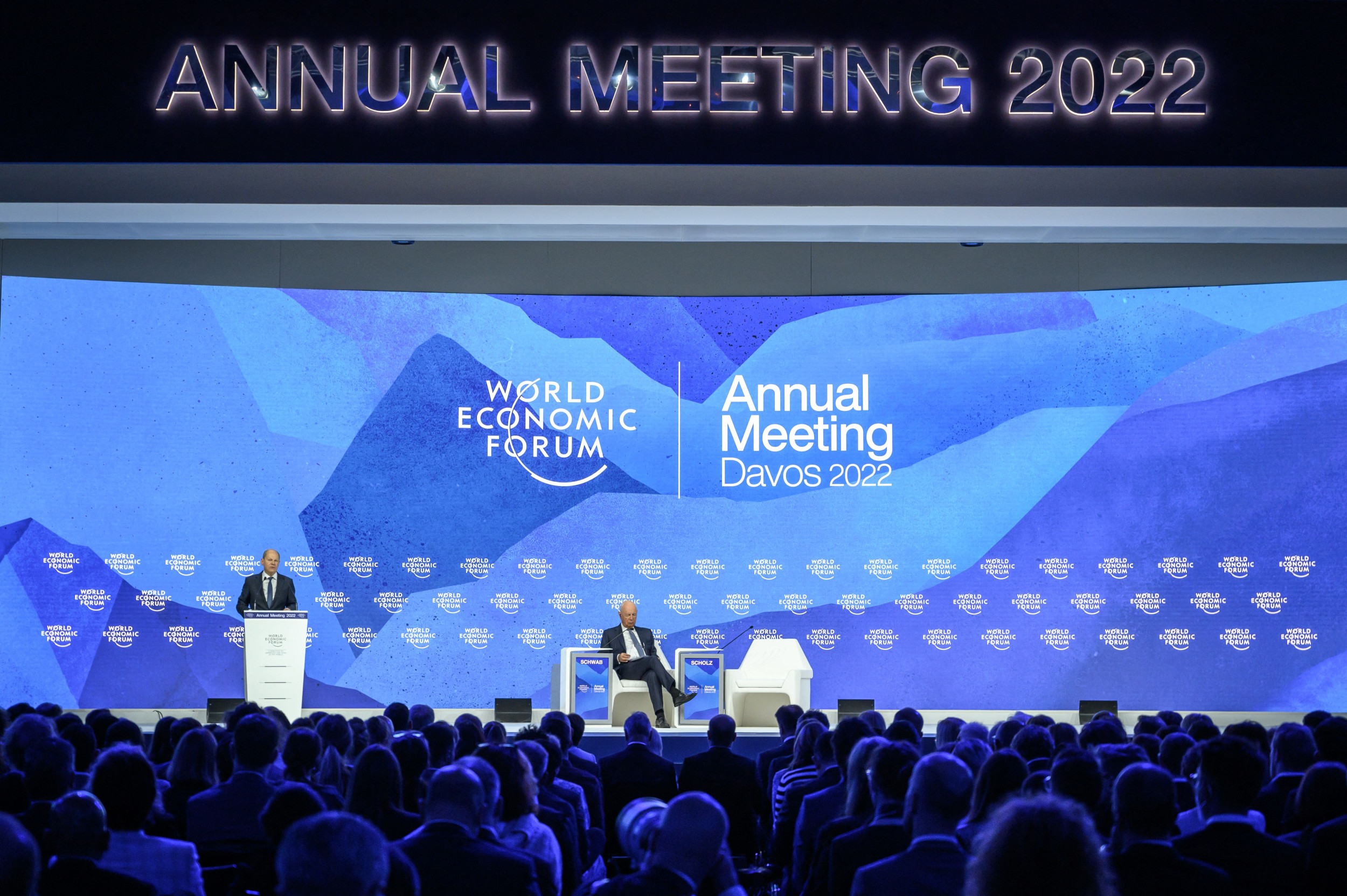 German Chancellor Olaf Scholz (L) addresses the