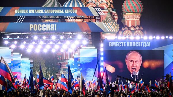 Russian President Vladimir Putin is seen on a screen set at Red Square in Moscow on Sept. 30, as he addresses a rally marking the annexation of four regions of Ukraine occupied by Russian troops: Lugansk, Donetsk, Kherson and Zaporizhzhia.