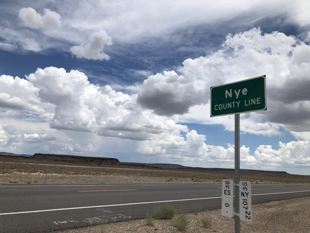 A photo of the sign next to the road entering Nye County.