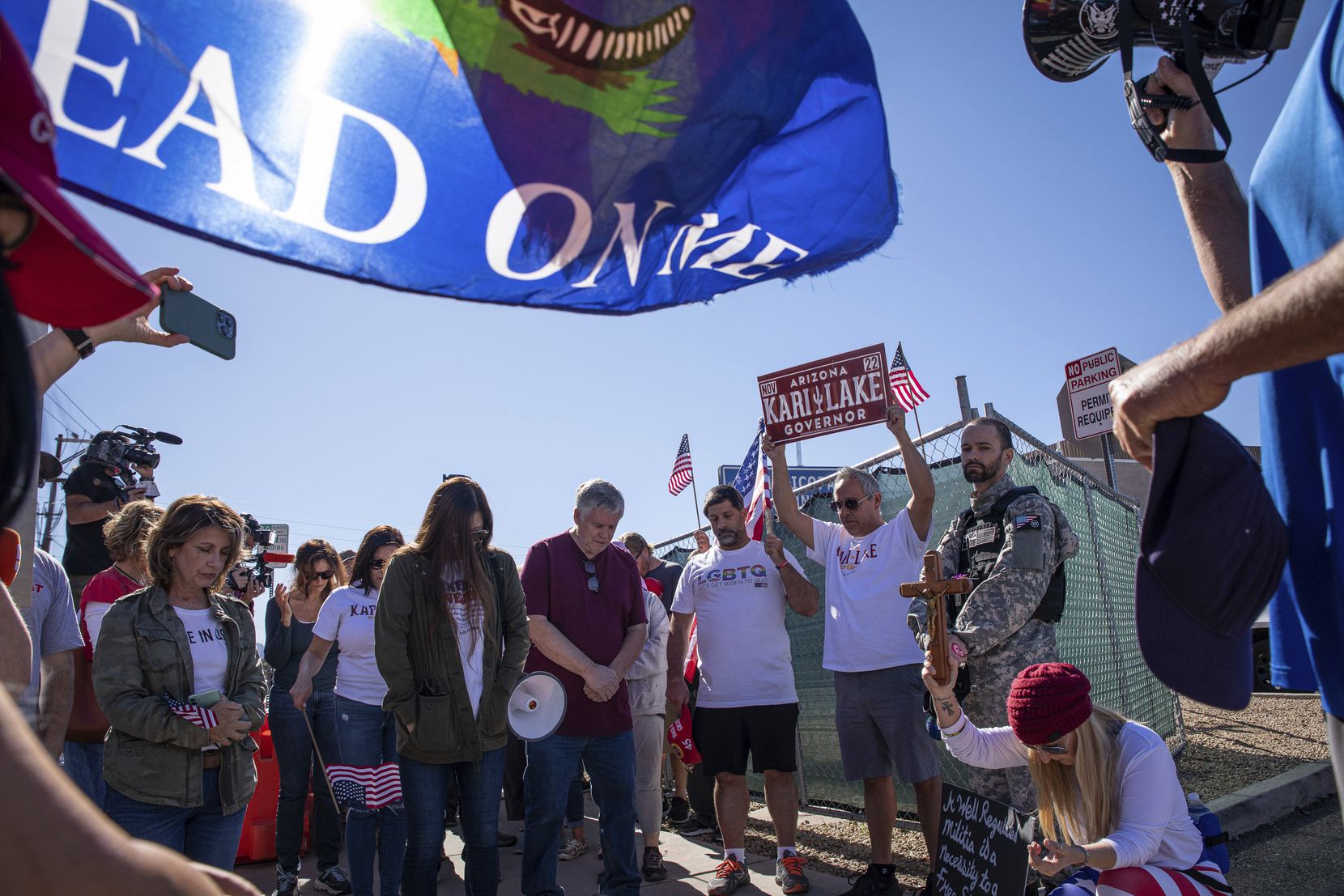 Republican supporters stand outside the Maricopa County Recorder's Office to protest what...