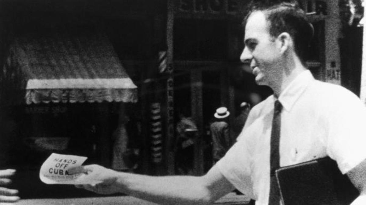 Lee Harvey Oswald distributes Hands Off Cuba flyers on the streets of New Orleans, Louisiana. This photograph was used in the Kennedy assassination investigation. (Credit: Corbis via Getty Images)