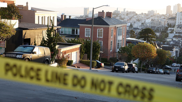 Police tape is seen in front of the home of House Speaker Nancy Pelosi and her husband, Paul Pelosi, on Friday in San Francisco. Paul Pelosi was violently attacked in their home by an intruder.