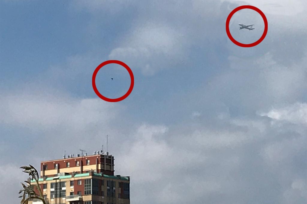 small dot in sky believed to be an alien craft; airplane nearby