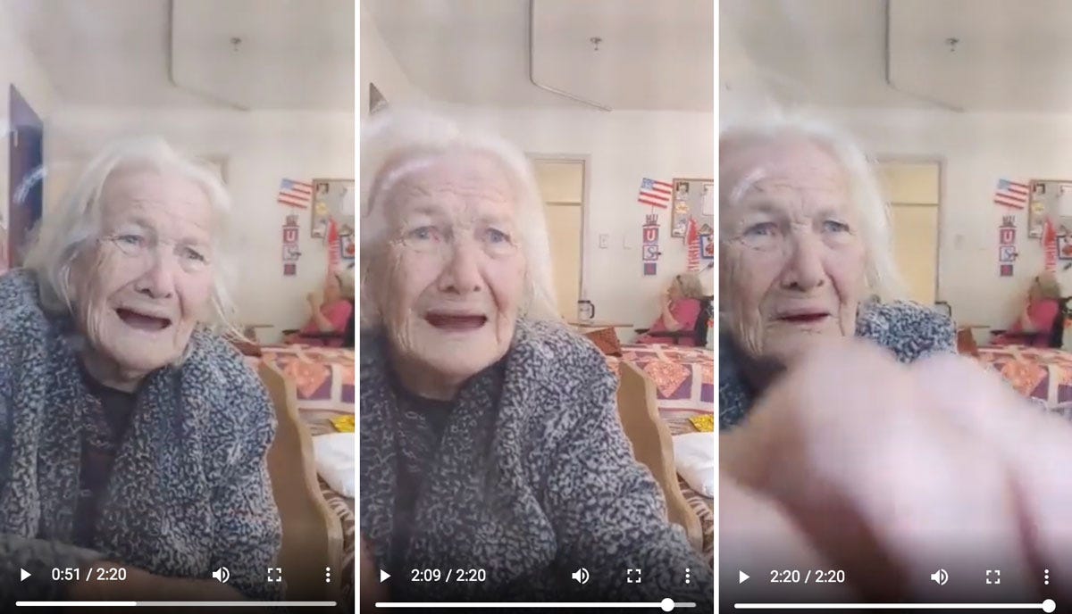 Elderly Woman in Nursing Home Being Prevented by Social Distancing from Touching Family, Who Are Talking to Her Through the Window