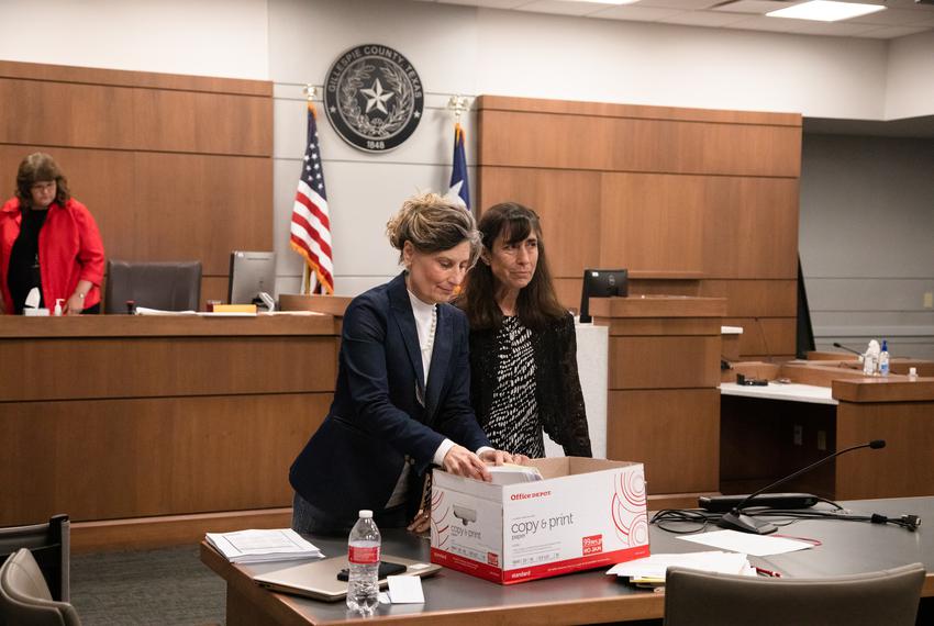 Laura Pressley and Jeannette Hormuth pack up evidence and legal papers after a trial disputing the integrity of a special election, held in November 2019, at the Gillespie County Jail in Fredericksburg, on Oct. 10, 2022. Pressley aimed to show that the election process was flawed, and that mistakes made in the tabulation of election results meant that the true outcome of the 2019 special election could not be determined.