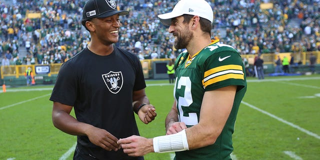 Green Bay Packers quarterback Aaron Rodgers (12) talks with Oakland Raiders quarterback DeShone Kizer after a game at Lambeau Field Oct. 20, 2019, in Green Bay, Wis.