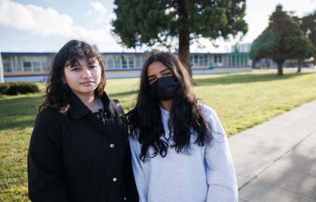 Mt. Eden High School students Myldret Vazquez, left, and Ruchita Verma in front of their school in Hayward, Calif., on Thursday, Feb. 23, 2023. (Dai Sugano/Bay Area News Group)