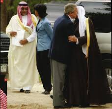 President Bush greets Saudi Prince Bandar with Condoleezza Rice in the background standing with the Saudi King at Bush's Texas property.