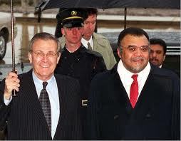 Donald Rumsfeld greeting Saudi Prince Bandar