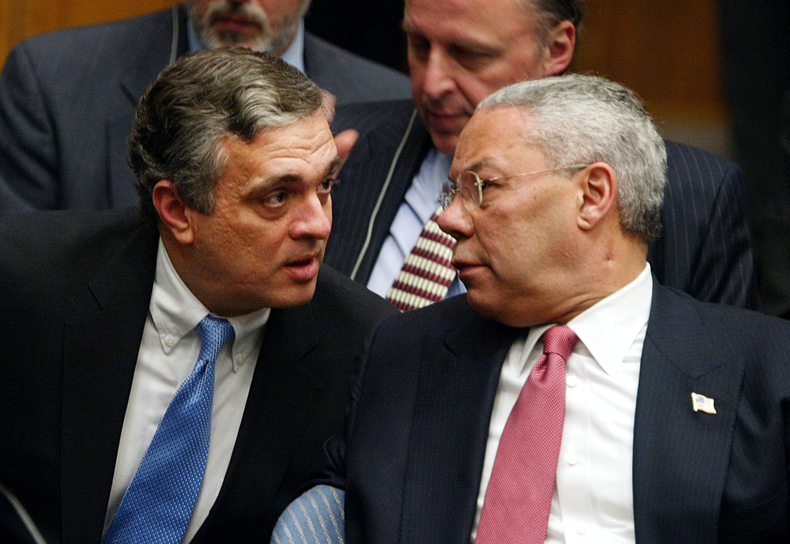 NEW YORK - FEBRUARY 5: CIA Director George Tenet (L) and U.S. Secretary of State Colin Powell speak following Powell's address to the UN Security Council February 5, 2003 in New York City. Powell made a presentation attempting to convince the world that Iraq is deliberately hiding weapons of mass destruction. (Photo by Mario Tama/Getty Images)