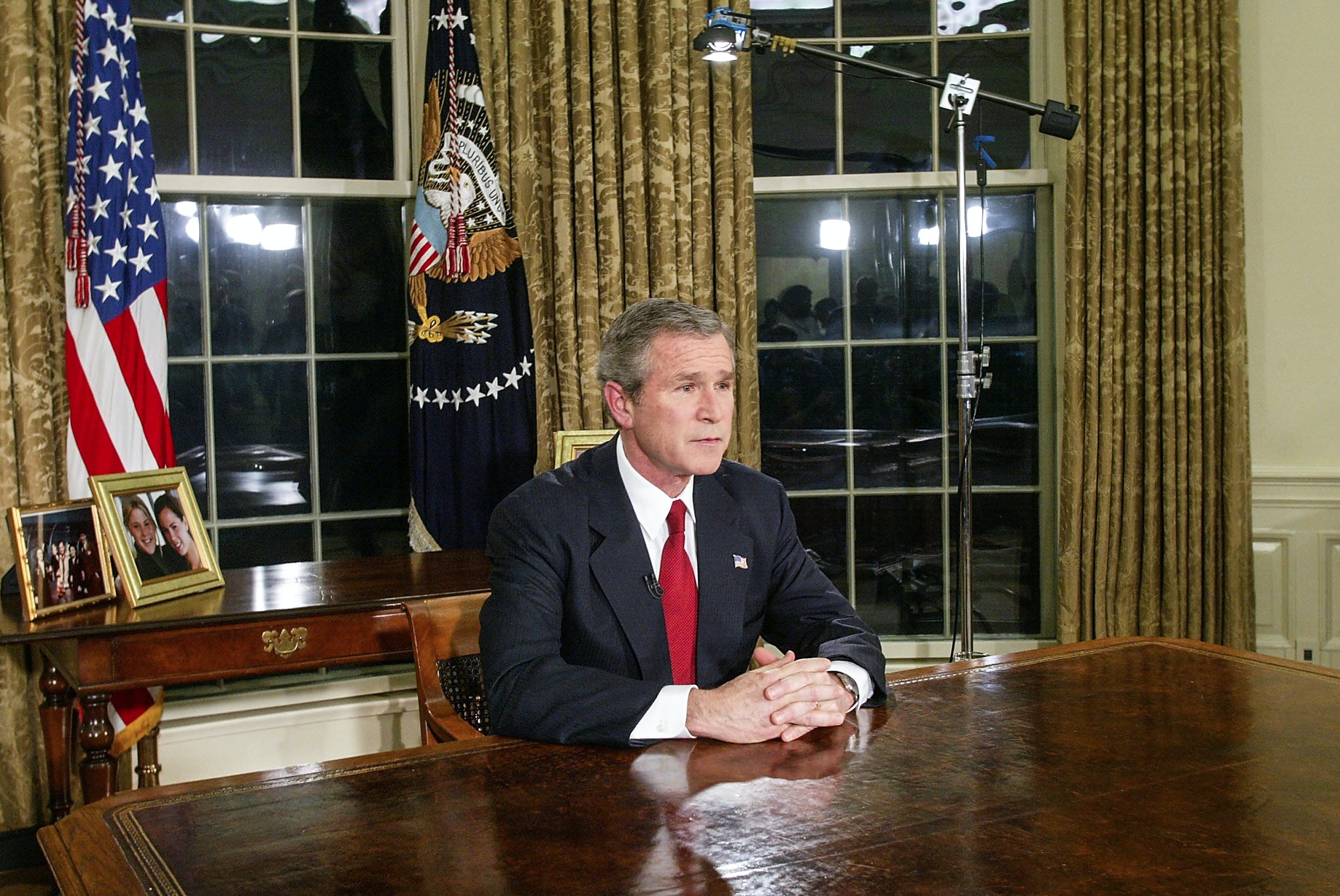 WASHINGTON - MARCH 19: U.S. President George W. Bush addresses the nation March 19, 2003 in the Oval Office of the White House in Washington, DC. Bush announced that the U.S. military struck at "targets of opportunity" in Iraq March 19, 2003 in Washington, DC. Air defense sirens and anti-aircraft fire was reported briefly in Baghdad. (Photo by Alex Wong/Getty Images)