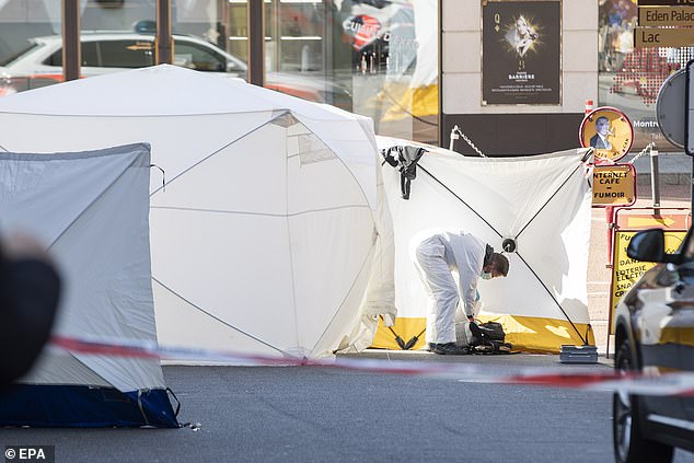 Forensic officers at the scene where the five family members were found after they jumped