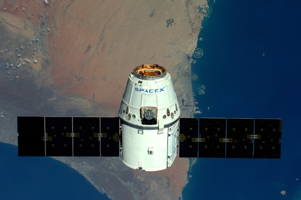 A view of The Palms, Dubai as the SpaceX Dragon spacecraft passes.