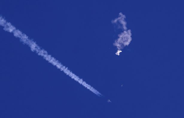 the remnants of a large balloon drift above the Atlantic Ocean