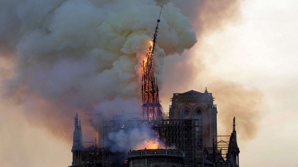 PHOTO: The steeple of the landmark Notre-Dame Cathedral collapses as the cathedral is engulfed in flames in Paris, April 15, 2019. 