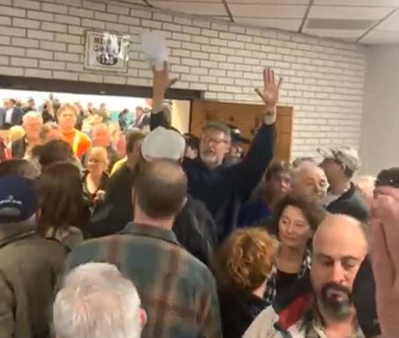 People fill the room in the area just outside of council chambers at the County of Essex.