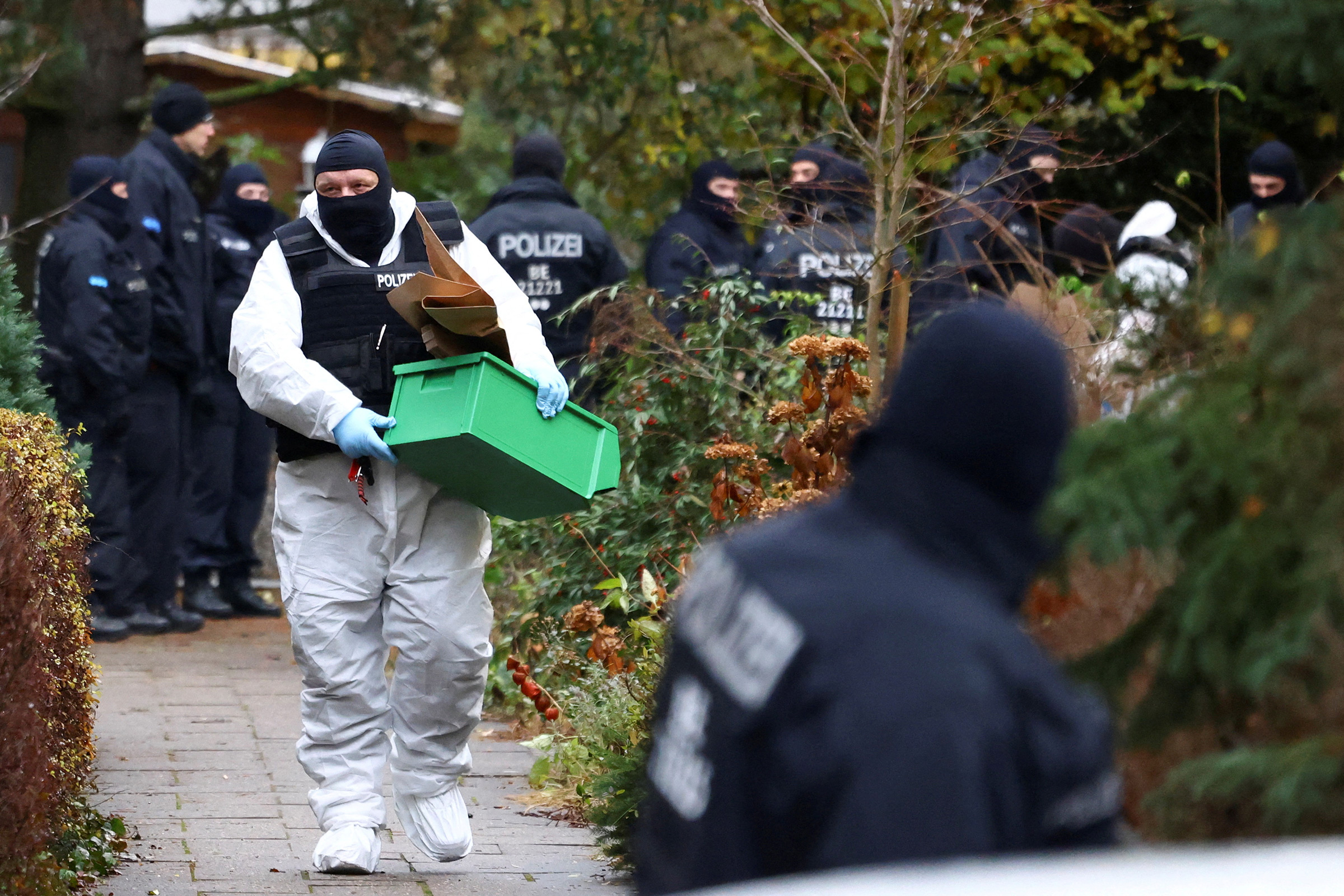 Police secure an area in Berlin after 25 suspected members and supporters of a far-right group were detained during raids across Germany, Dec. 7, 2022. (Christian Mang—Reuters)