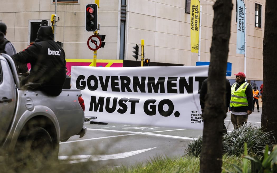 Anti-government protester in Wellington, marching towards Parliament on 23 August 2022.