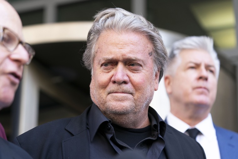 Former White House strategist Steve Bannon, accompanied by his attorneys David Schoen, left and M. Evan Corcoran, right, speaks with the media departs federal court, Friday, July 22, 2022, in Washington. Bannon, a longtime ally of former President Donald Trump has been convicted of contempt charges for defying a congressional subpoena from the House committee investigating the Jan. 6 insurrection at the U.S. Capitol. (AP Photo/Jose Luis Magana)