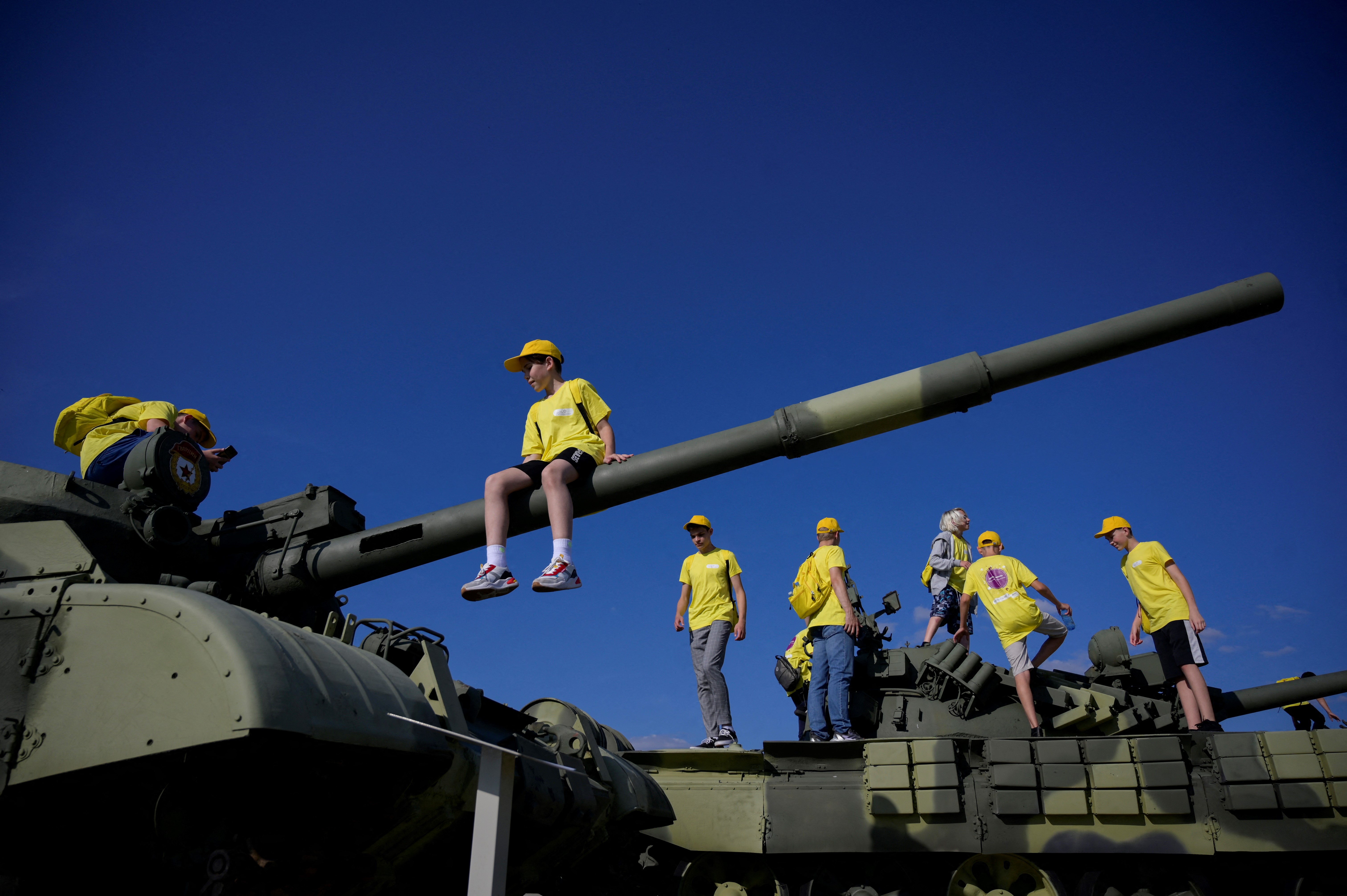 Children climb atop a tank as they tour Patriot Park, a sort of military Disneyland outside Moscow aimed at showcasing Russia's military might, in 2022.