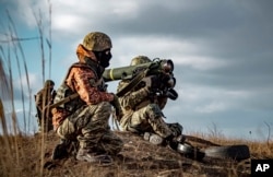 Ukrainian soldiers use a Javelin missile system during military exercises in the Donetsk region on December 23, 2021. (Ukrainian Defense Ministry Press Service/ via AP)