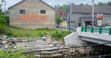 Messages painted on Gardiner building raise eyebrows with QAnon message, code violation