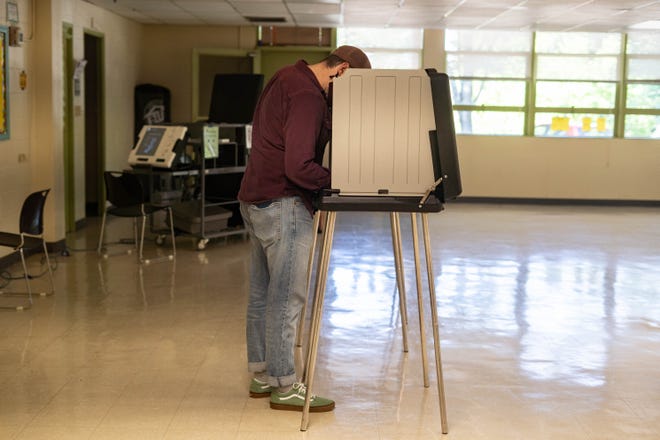 A voter marks their ballot at the West Asheville Community Center polling location on May 17, 2022.