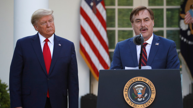 FILE - In this March 30, 2020, file photo, My Pillow CEO Mike Lindell speaks as President Donald Trump listens during a briefing about the coronavirus in the Rose Garden of the White House, in Washington. (AP Photo/Alex Brandon, File)