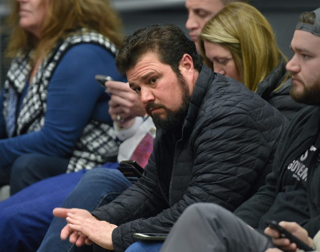 Robert Beadles, leaning forward, listens during public comment portion of the Washoe County Board of Commissioners meeting in February 2022.