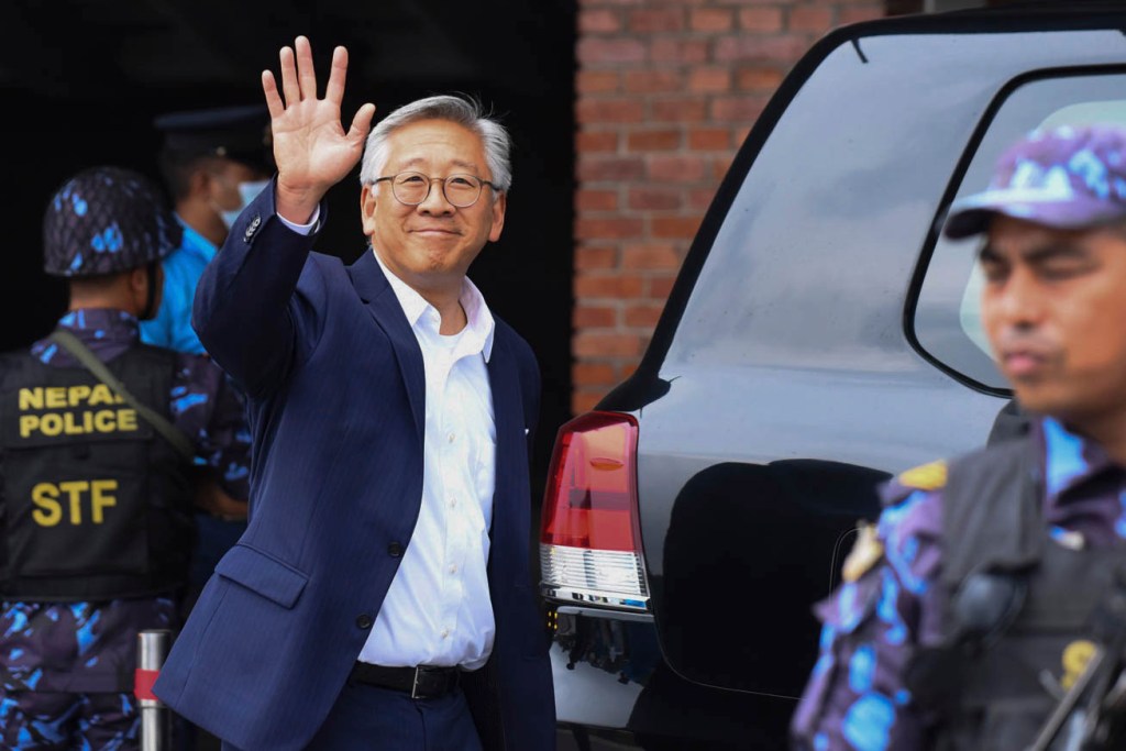 On July 14, 2023, in Kathmandu, Nepal. "Donald Lu," a diplomat in service and Assistant Secretary of State for South and Central Asian Affairs, wave towards media personnels upon his arrival at Tribhuvan International Airport (TIA).   During his visit to Nepal, Minister Lu is scheduled to meet with officials and ministers of the Government of Nepal. According to the US Embassy in Nepal, Lu will also meet with a representative of a member organization of the American Chamber of Commerce. (Photo by Abhishek Maharjan/Sipa USA)(Sipa via AP Images)