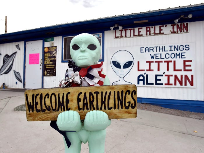 A sign outside an alien-themed restaurant