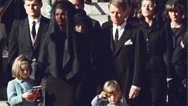 John F. Kennedy Jr., salutes his father's casket in Washington. Pic: AP