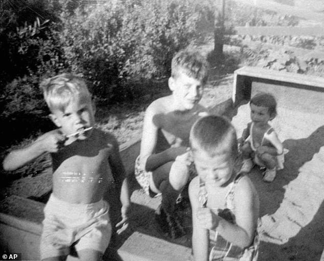 Raised in a working-class Polish-American family in the suburb of Evergreen Park, Kaczynski (center) demonstrated exceptional intelligence from an early age. Kaczynski said his childhood was an unhappy one in part because his parents pushed him hard academically, which contributed to his intense anger towards his family later in life