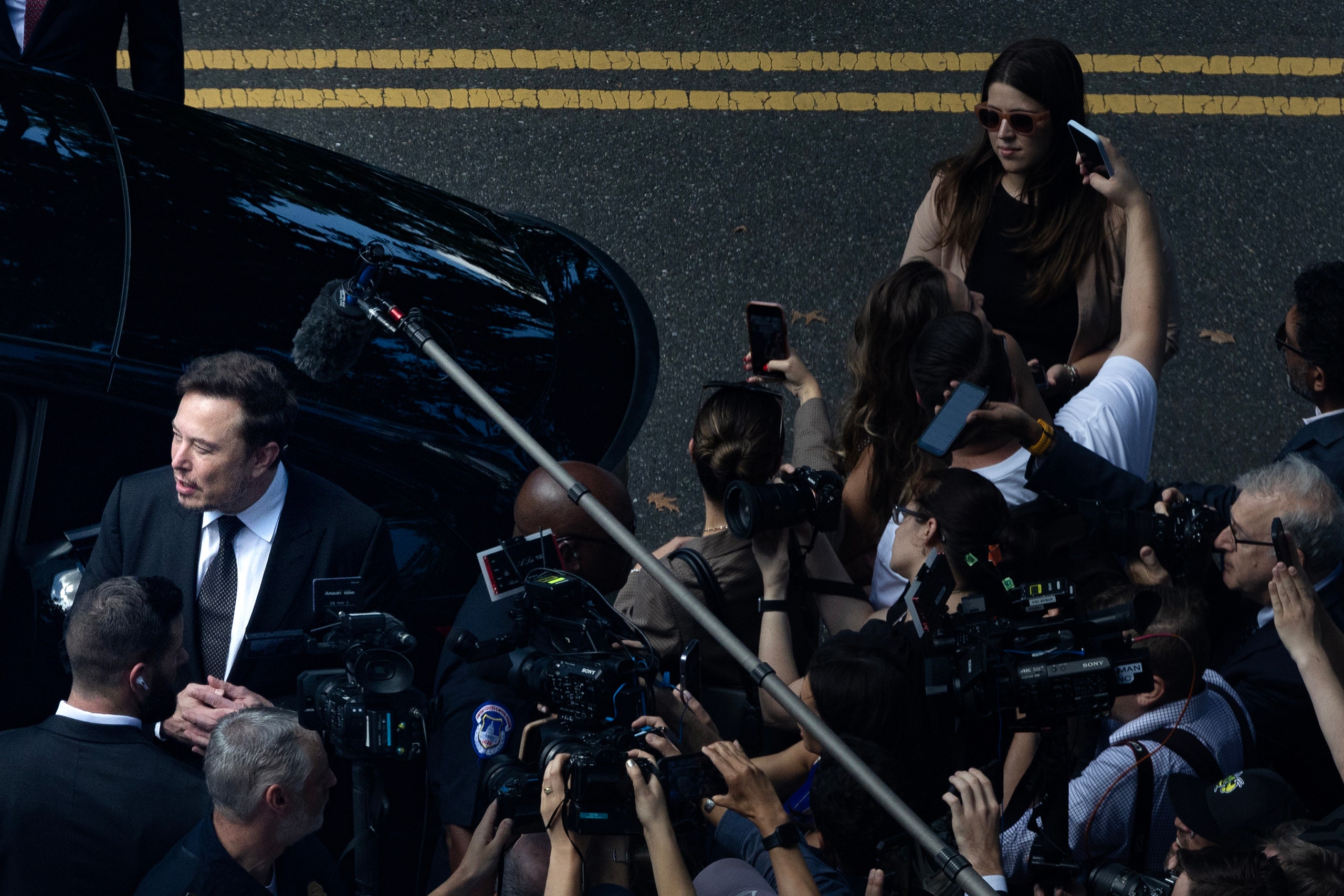 Elon Musk speaking to a crowd of reporters outside of the United States Capitol