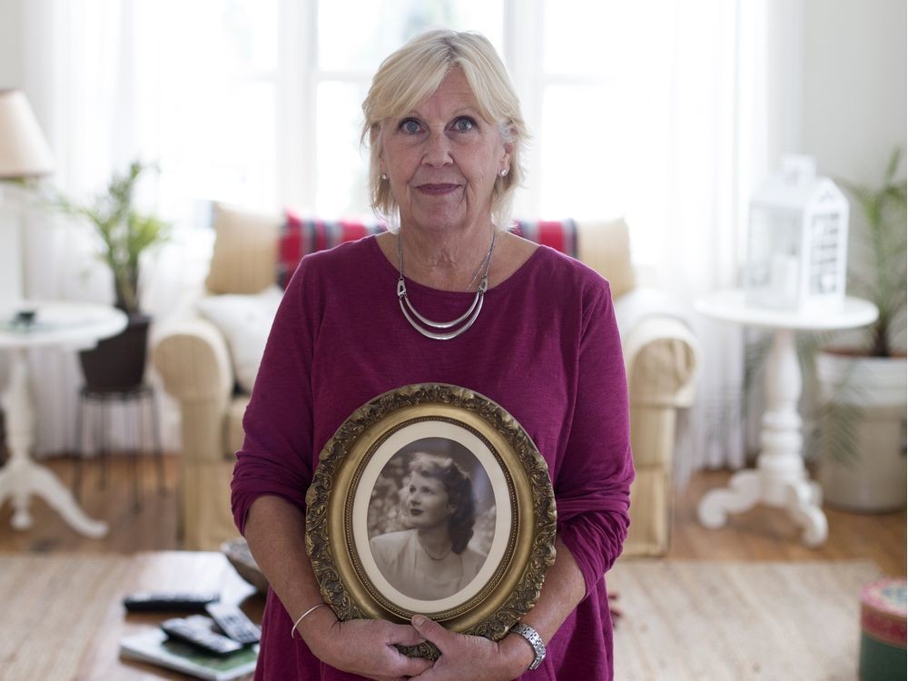 Alison Steel holds a photo of her mom, Jean Steel, in her home in Knowlton, Quebec in 2017. A lawsuit filed by Steel alleges her mother was subjected to unethical mind-control experiments by the CIA.