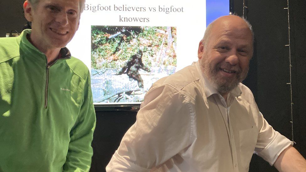 Eddy Corry a Fortean society member and Gordon Rutter posing in front of Bigfoot slide