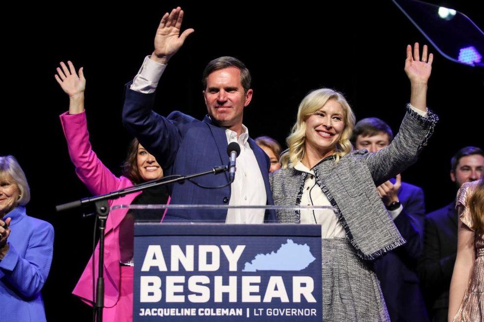 Kentucky Governor Andy Beshear waves with his wife Britainy Beshear