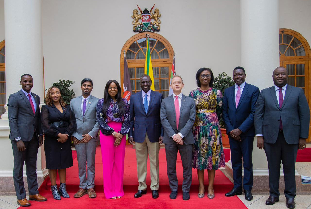 Stephen poses for a photo op with President William Ruto and others at the State House.