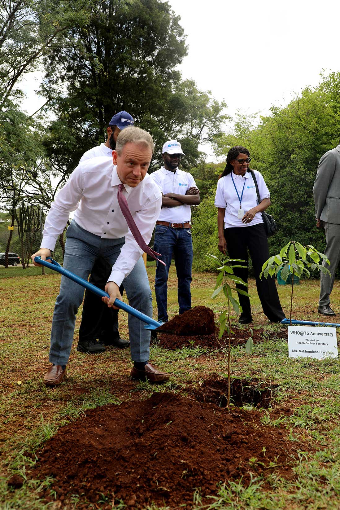Stephen is seen planting a tree