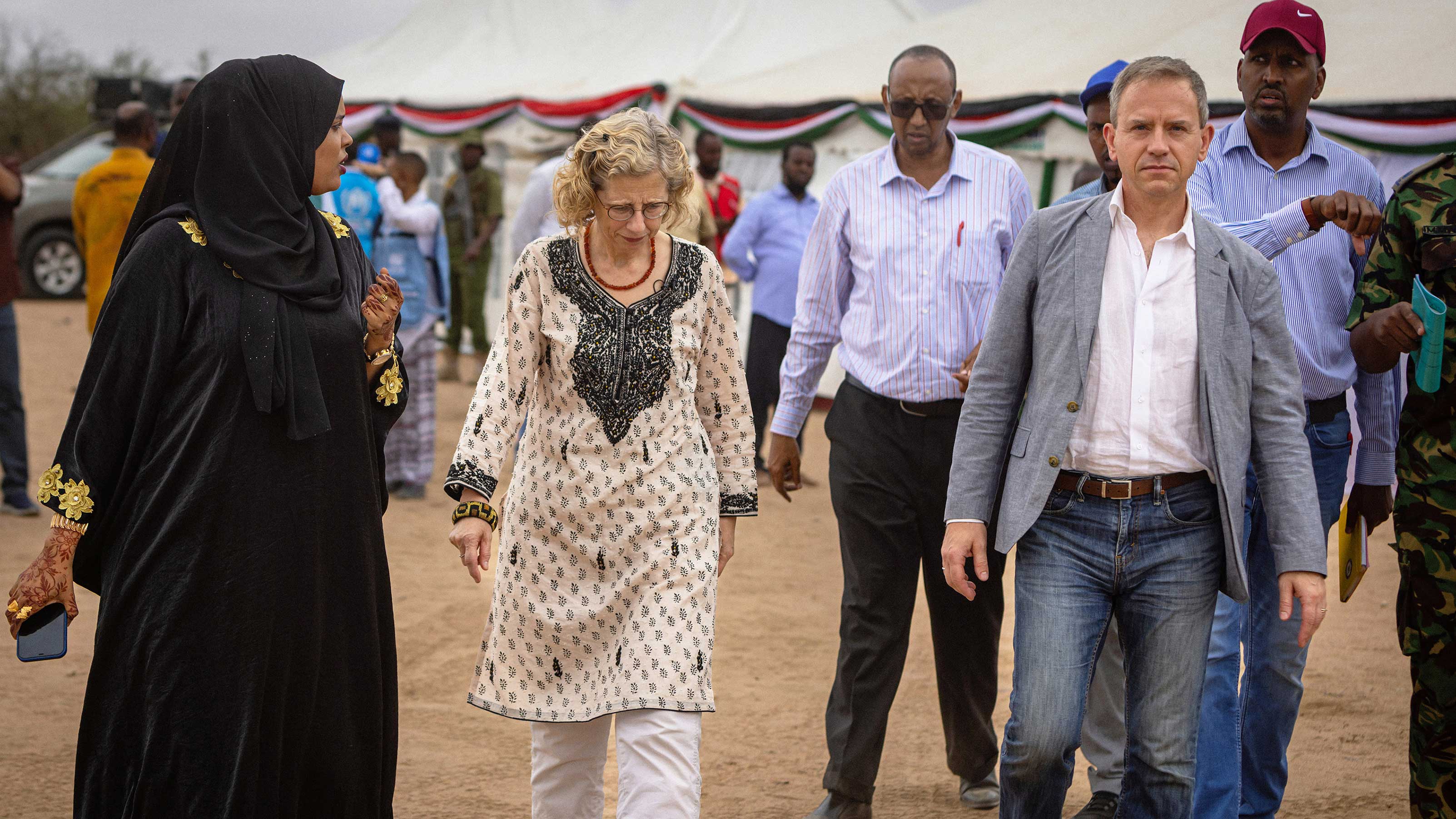 Stephen walks with UNEP Executive Director Inger Andersen and others.