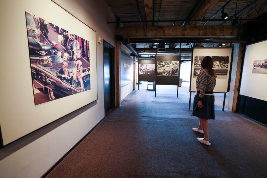 Kim Bryan, Chief Philanthropy Officer, looks around the exhibition Saturday, Nov. 18, 2023, at The Sixth Floor Museum at Dealey Plaza in Dallas. The exhibition documents the assassination and legacy of President John F. Kennedy. 