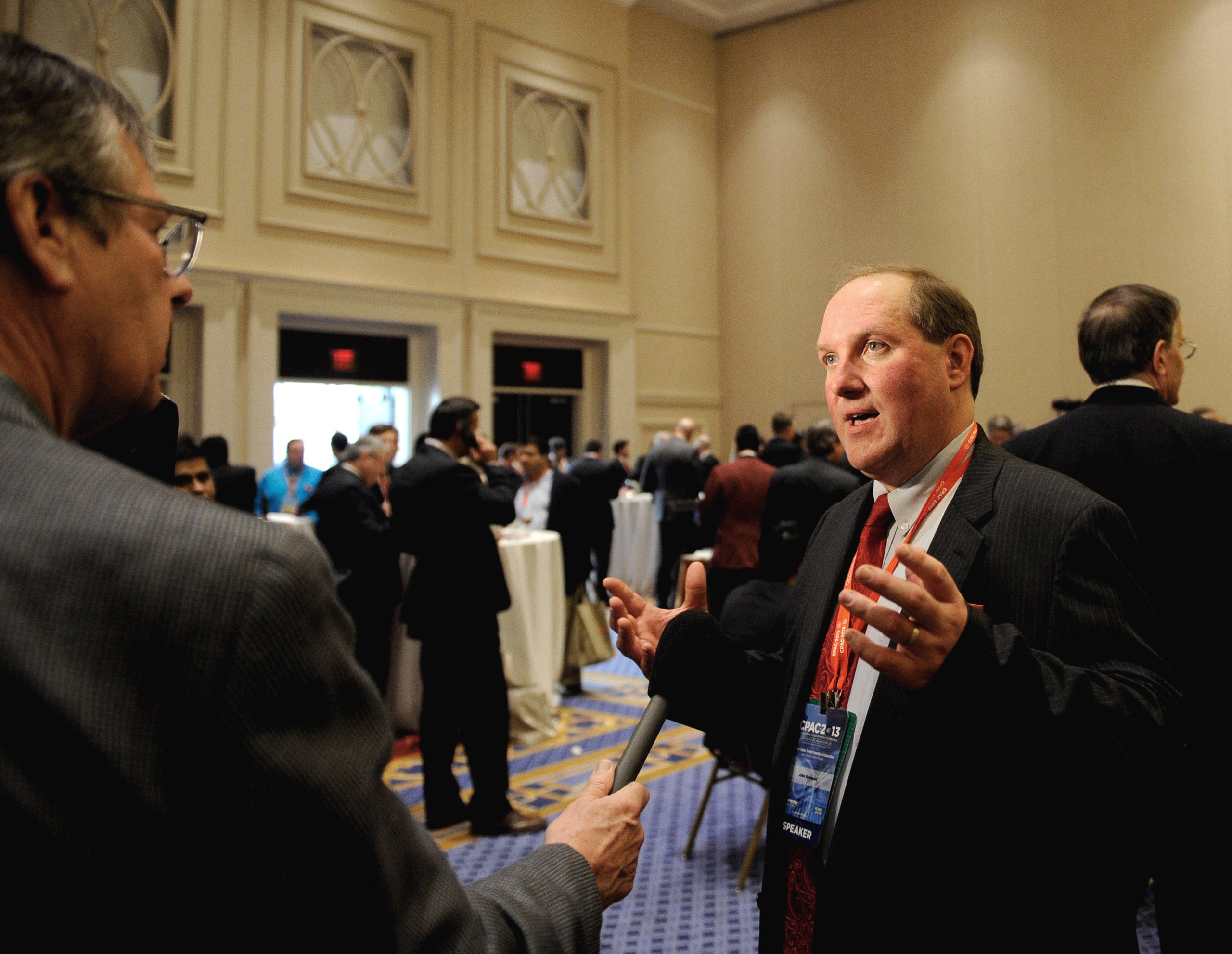 John Solomon speaks to a reporter.