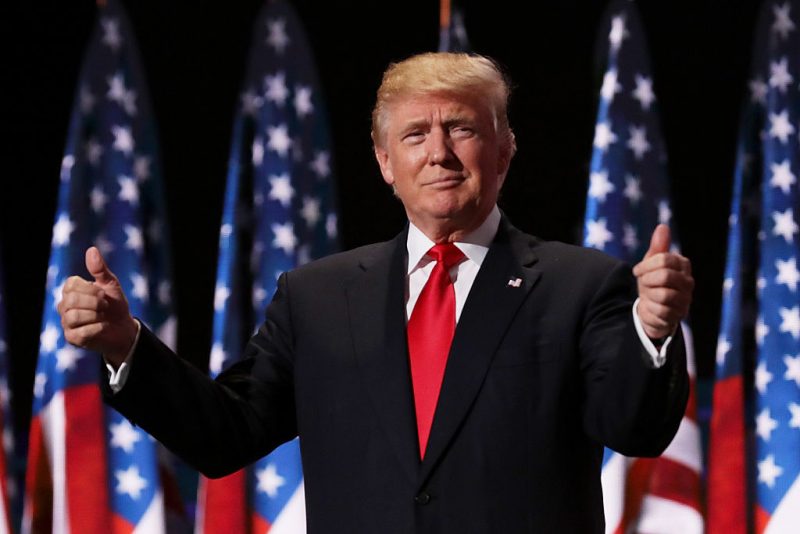 CLEVELAND, OH - JULY 21: Republican presidential candidate Donald Trump gives two thumbs up to the crowd during the evening session on the fourth day of the Republican National Convention on July 21, 2016 at the Quicken Loans Arena in Cleveland, Ohio. Republican presidential candidate Donald Trump received the number of votes needed to secure the party's nomination. An estimated 50,000 people are expected in Cleveland, including hundreds of protesters and members of the media. The four-day Republican National Convention kicked off on July 18. (Photo by Chip Somodevilla/Getty Images)