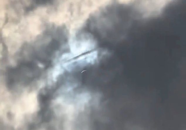 UFO spotted shooting through clouds over Texas during solar eclipse