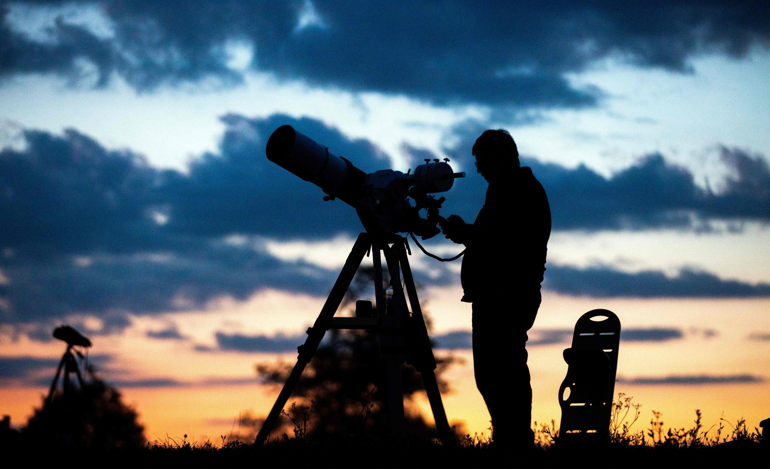 A man with a telescope