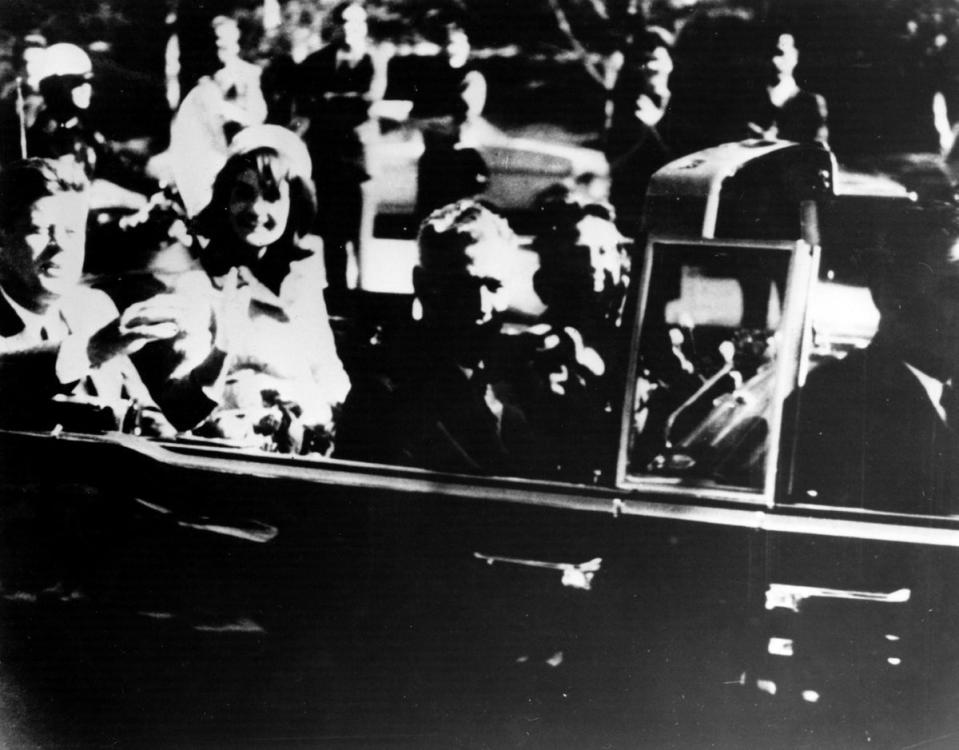 President John F Kennedy and first lady Jacqueline Kennedy in an open car motorcade shortly before he was assassinated in Dallas, Texas (Getty Images)