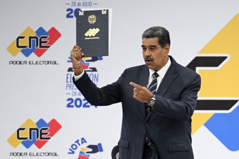 Venezuelan President Nicolas Maduro speaks next to the president of the National Electoral Council (CNE), Elvis Amoroso (out of frame), during his proclamation at the CNE headquarters in Caracas on July 29, 2024, a day after the Venezuelan presidential election. President Nicolas Maduro was declared the winner of Venezuela's presidential election but the opposition and key regional neighbours immediately rejected the official results. (Photo by Federico PARRA / AFP) (Photo by FEDERICO PARRA/AFP via Getty Images)