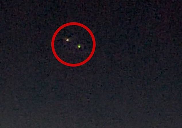 A pilot saw two UFOs hovering near each other over the Atlantic Ocean