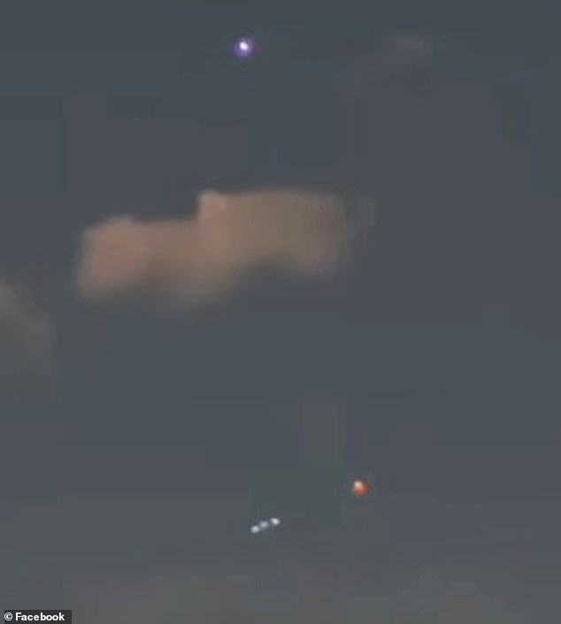 The flickering lights (pictured bottom) were seen below the moon with a woman's voice on the video calling the sighting 'bizarre'