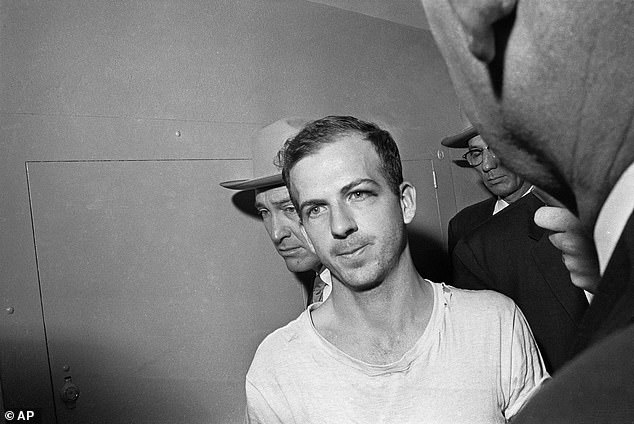 Some experts claim the documents will show the CIA aided Lee Harvey Oswald (pictured) in the attack